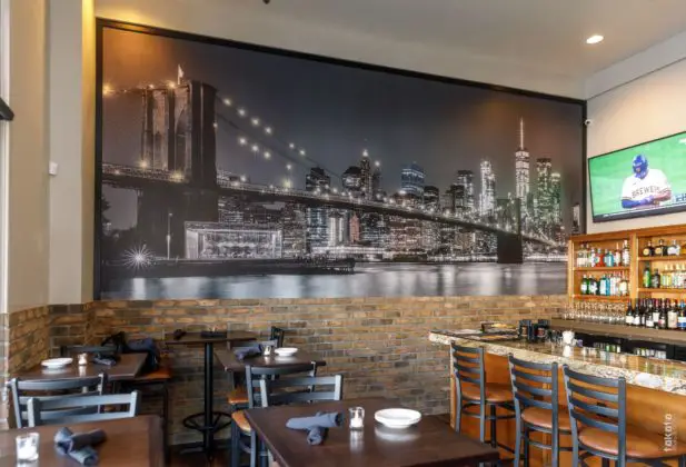 Joe's Italian Restaurant & Bar Features A Spacious Bar And Dramatic Mural Of The New York Skyline